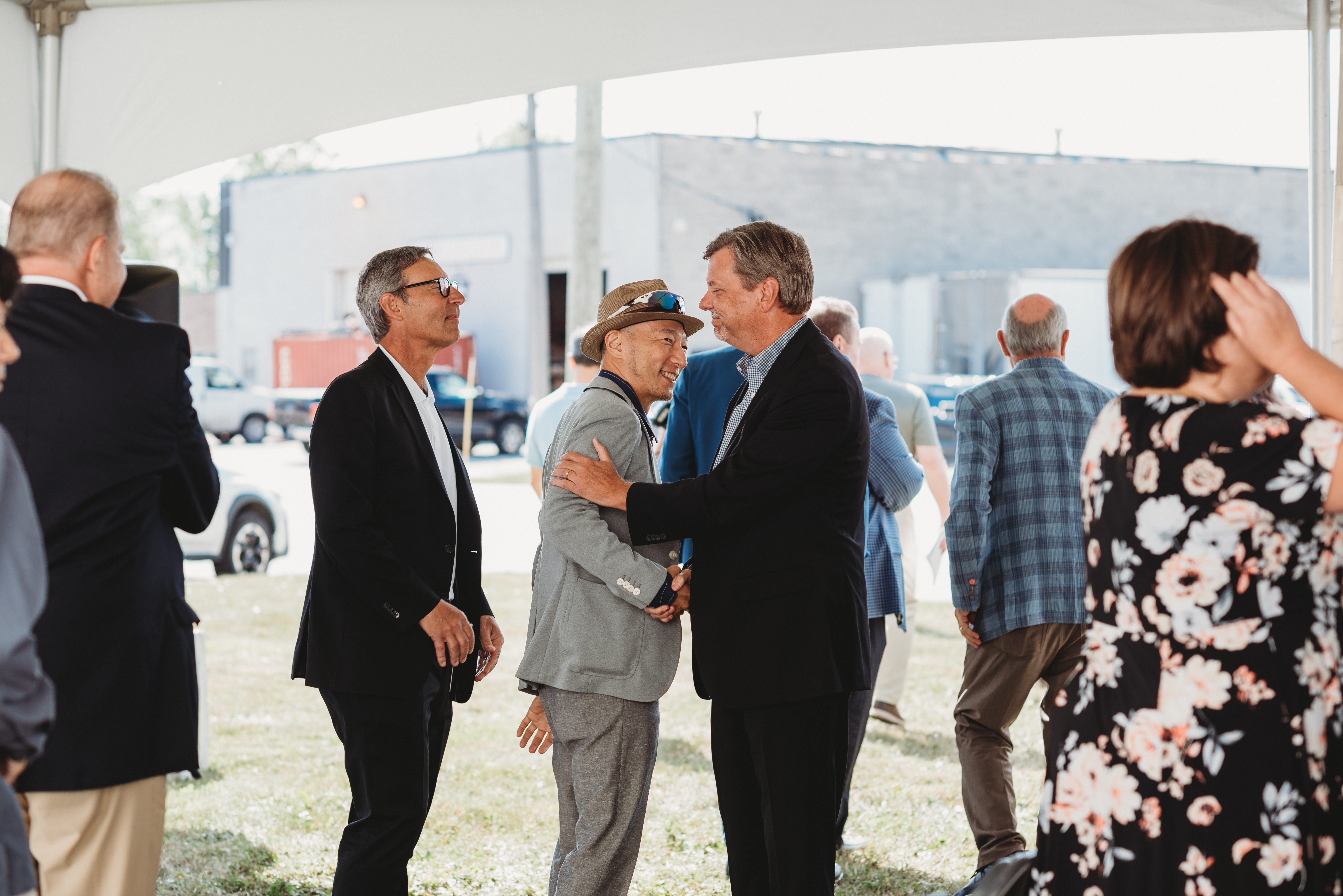 Ron Harker, President of Convoy Technologies, Shaking Hands with Guests at the Grand Opening Event