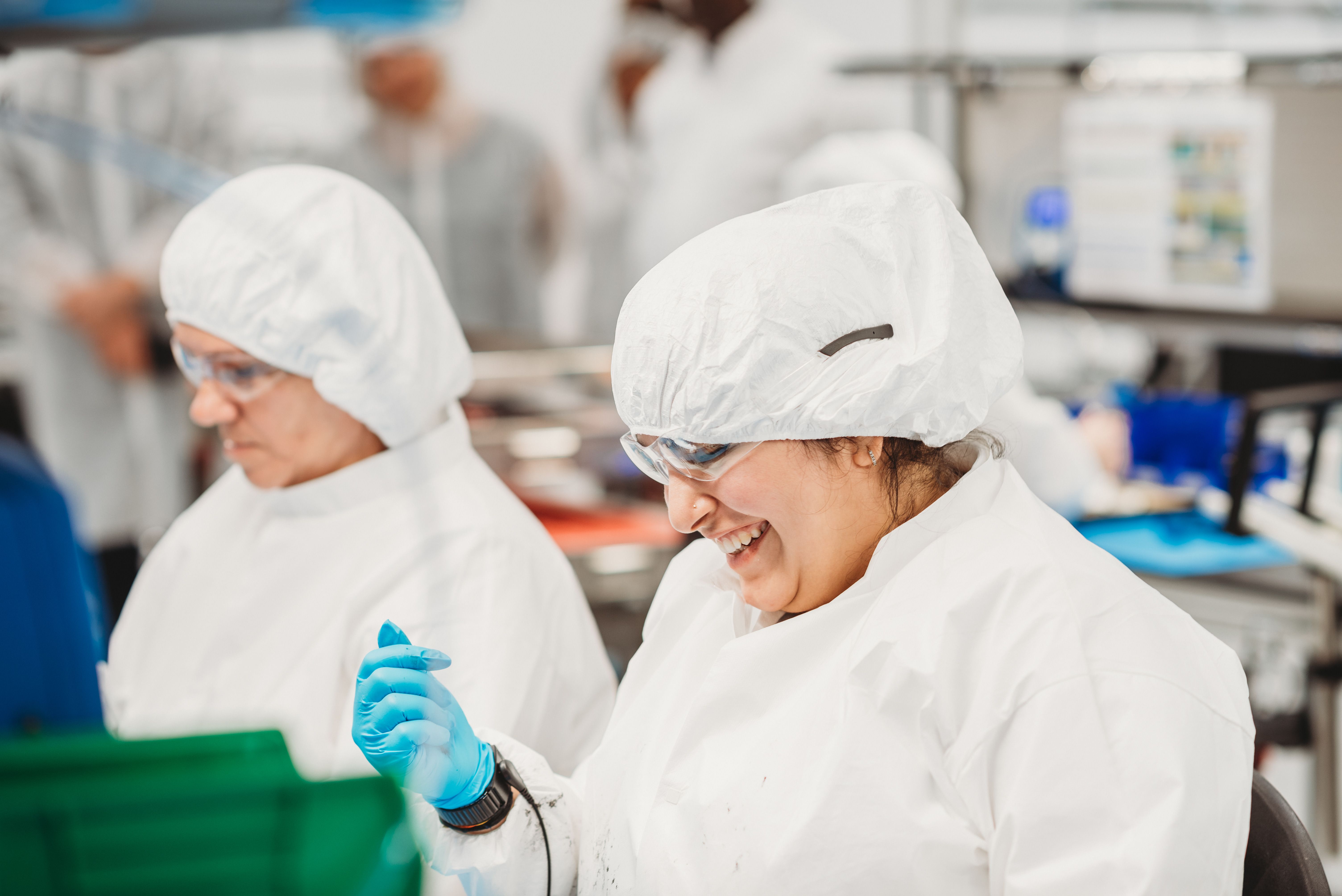 Two Convoy Technologies Employees Working and Smiling