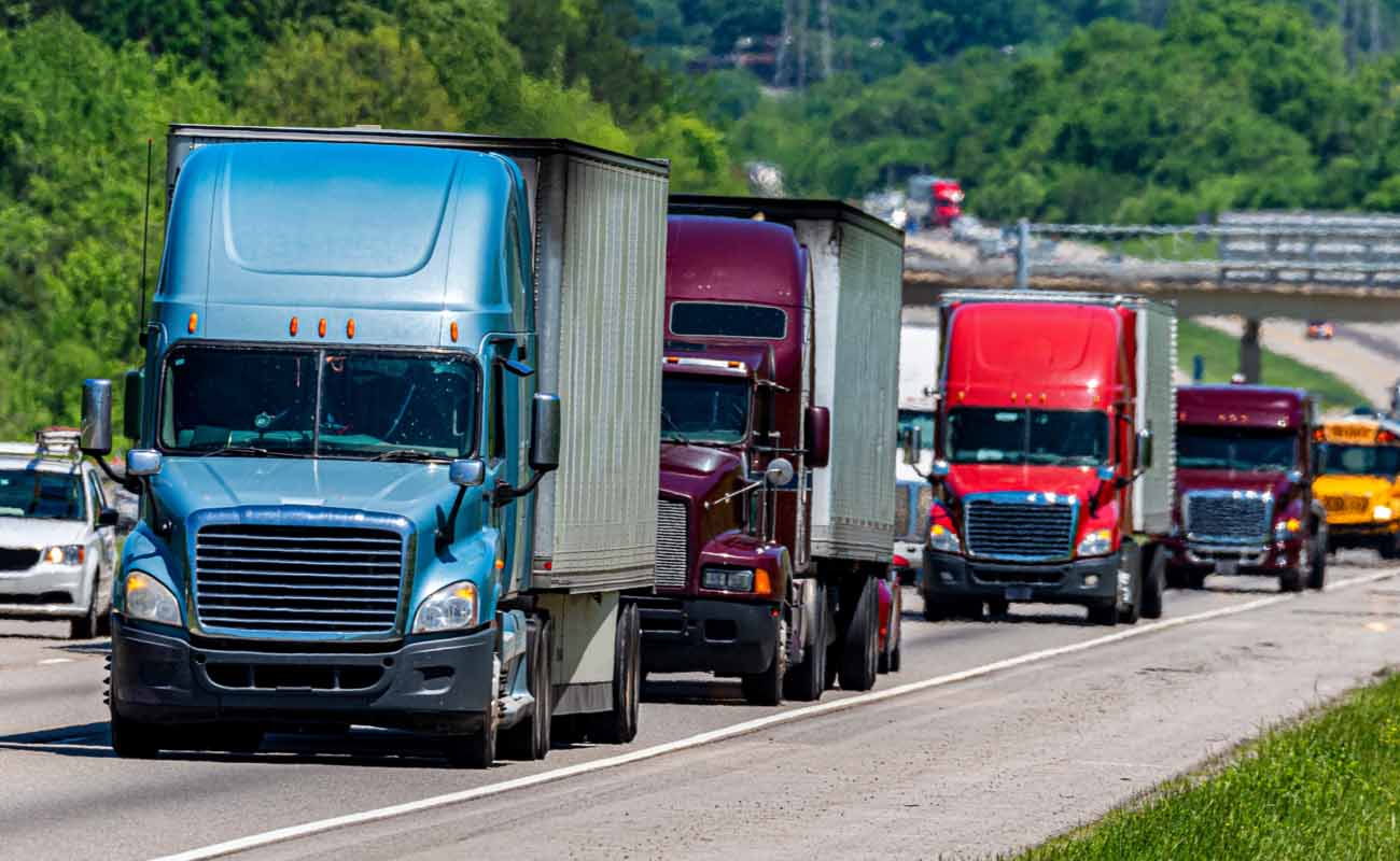 Multiple Semi-Truck Vehicles Driving on Highway Multiple Semi-Truck Vehicles Driving on Highway