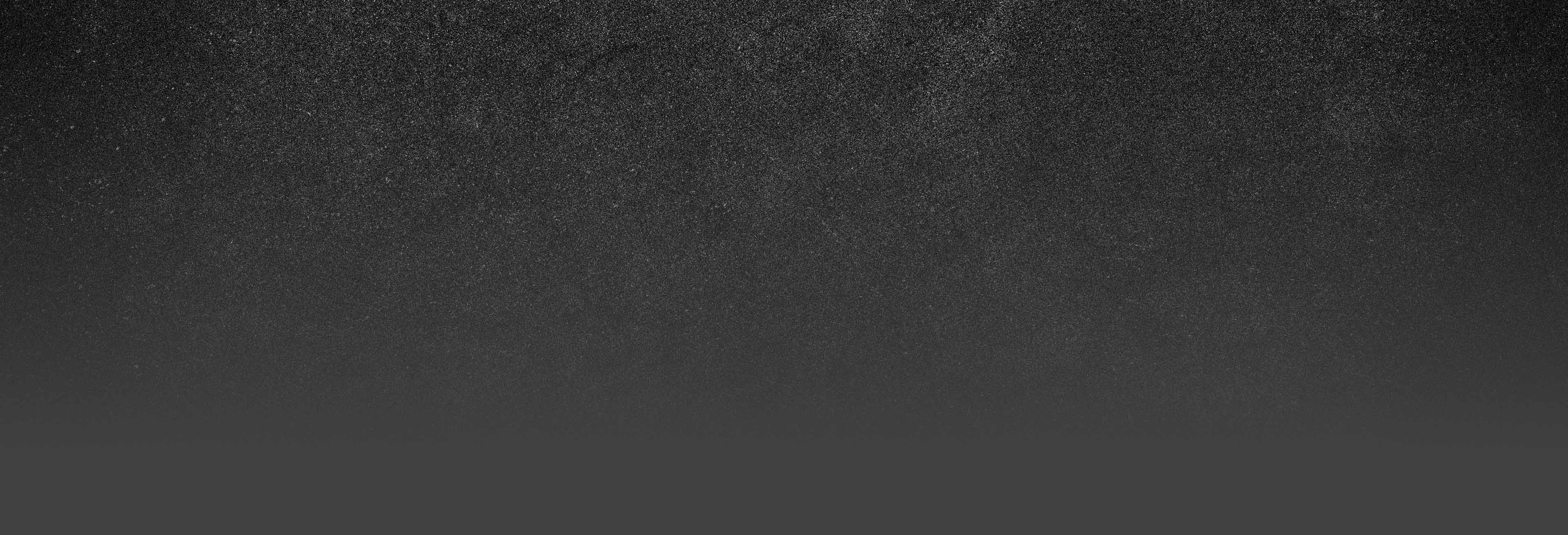 A dark gry background texture.